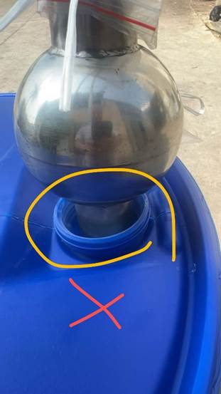 A round metal object on a blue container
AI-generated content may be incorrect.